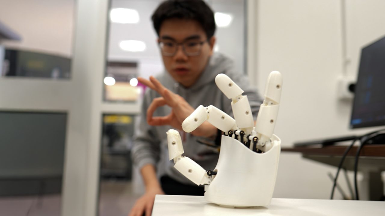 Wristband enables wearers to control a robotic hand with their own movements
